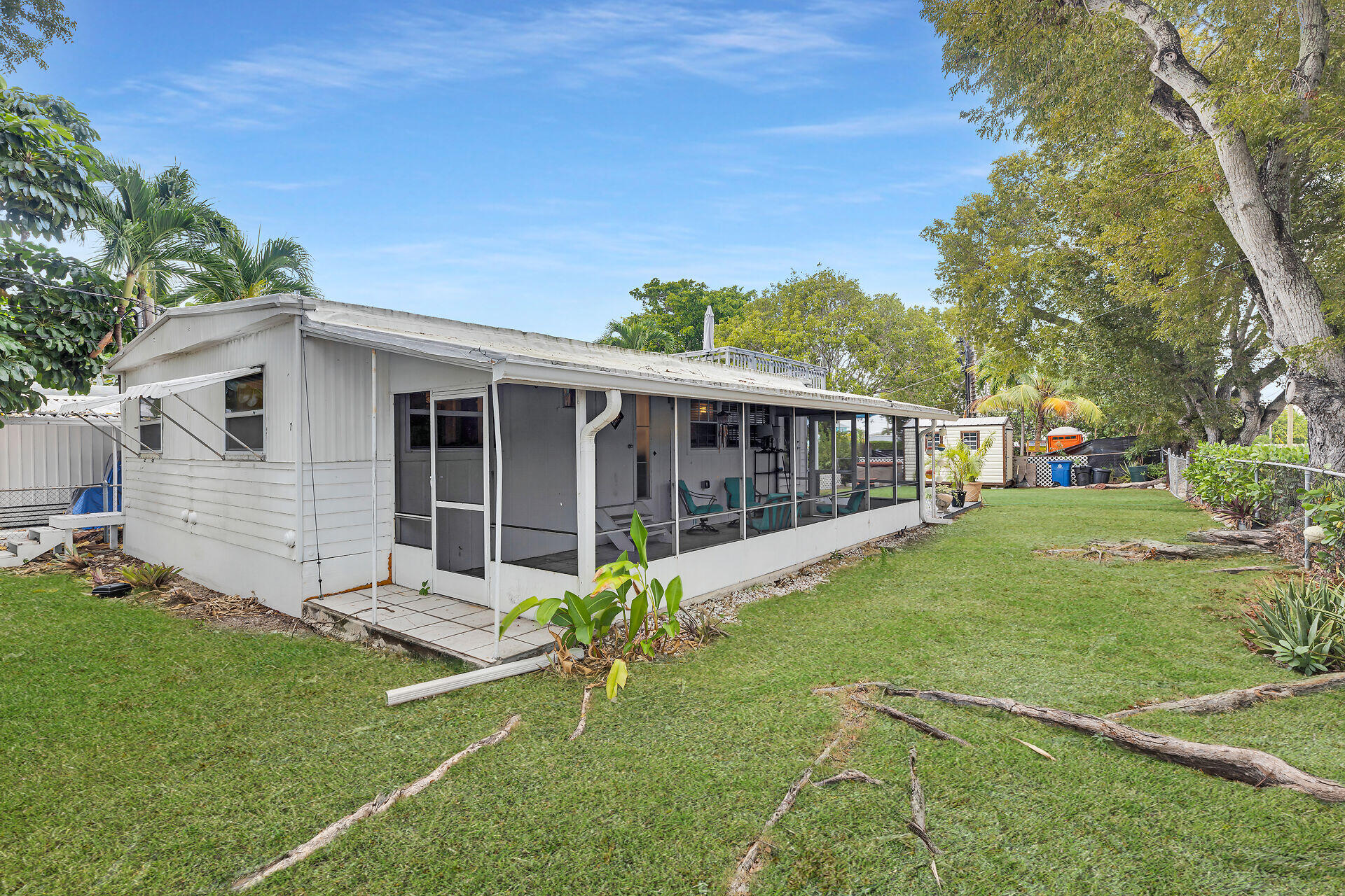 7 Avenue D Key Largo, FL 33037 - Photo 8 of 36 a view of a house with backyard and sitting area