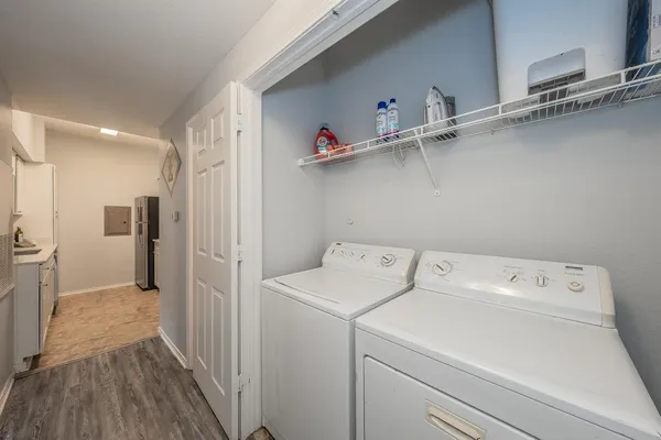 a view of storage and utility room with washer and dryer