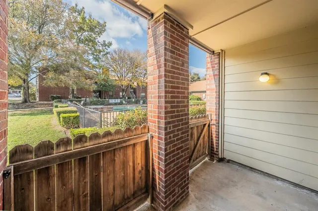 a view of a balcony with chairs