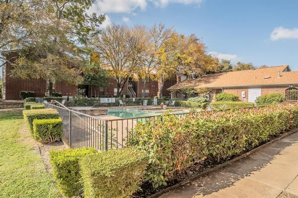a view of a swimming pool with a patio