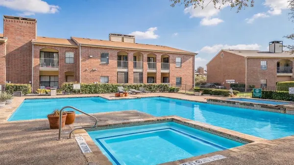 a view of swimming pool with outdoor seating and yard