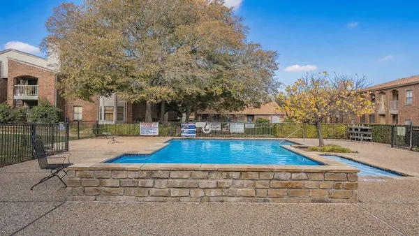a view of a yard with swimming pool