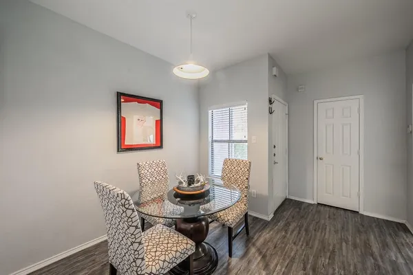 a view of a dining room with furniture and wooden floor