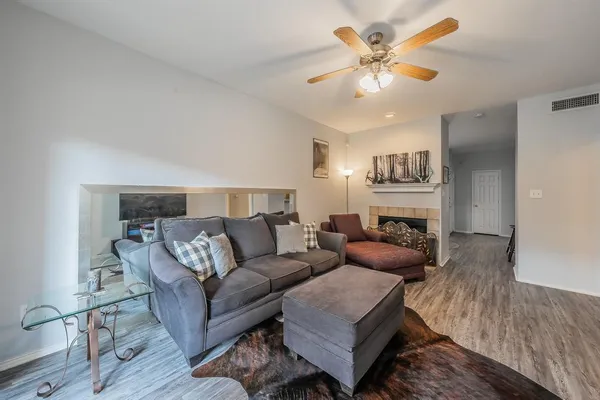 a living room with furniture and a fireplace