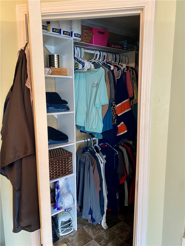 597 Sam Byrum Road Iva, SC 29655 - Photo 20 of 43 This organized closet features ample storage solutions for everyday essentials.