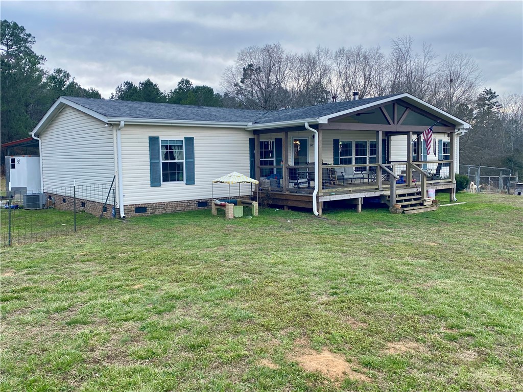 597 Sam Byrum Road Iva, SC 29655 - Photo 3 of 43 This charming home offers a welcoming porch, perfect for enjoying peaceful outdoor moments.