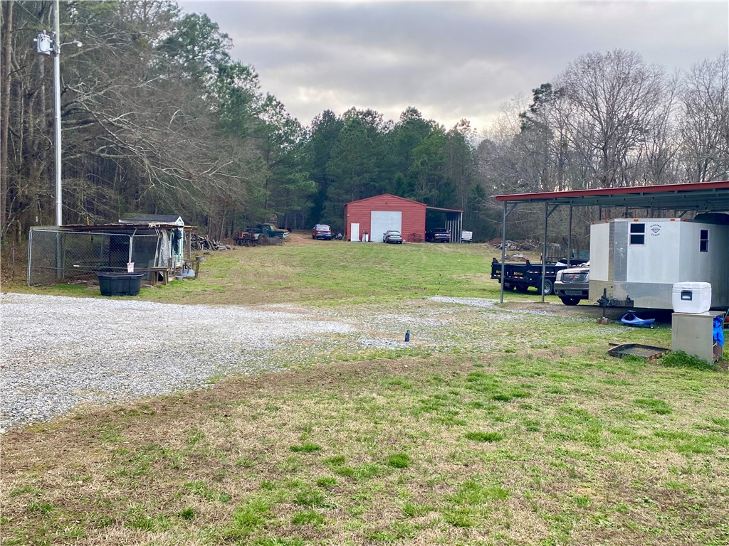 597 Sam Byrum Road Iva, SC 29655 - Photo 33 of 43 This spacious property offers ample open land, ideal for various outdoor activities and potential development.