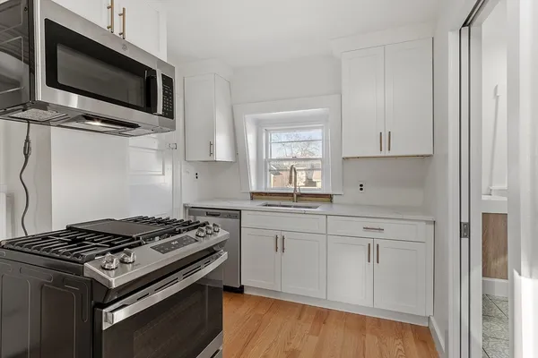 a kitchen with a stove and a microwave