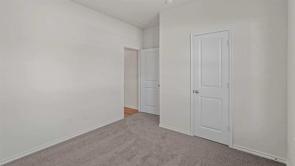 1627 Mantle Road Crandall, TX 75114 - Photo 30 of 40 Plush grey carpeting, white interior doors, and neutral wall finishes