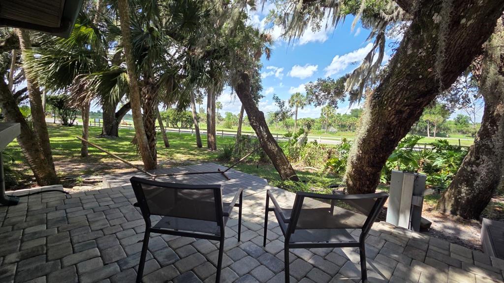 291 Bear Trail River Ranch, FL 33867 - Photo 20 of 23 a view of a chairs and table in the patio