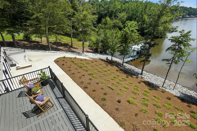 a view of balcony with wooden floor and outdoor seating