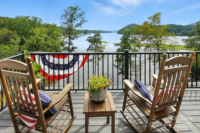 a balcony with furniture and a potted plant