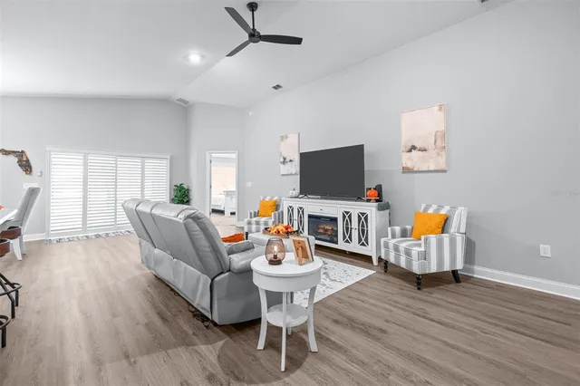 a large kitchen with stainless steel appliances a lot of counter space and wooden floor