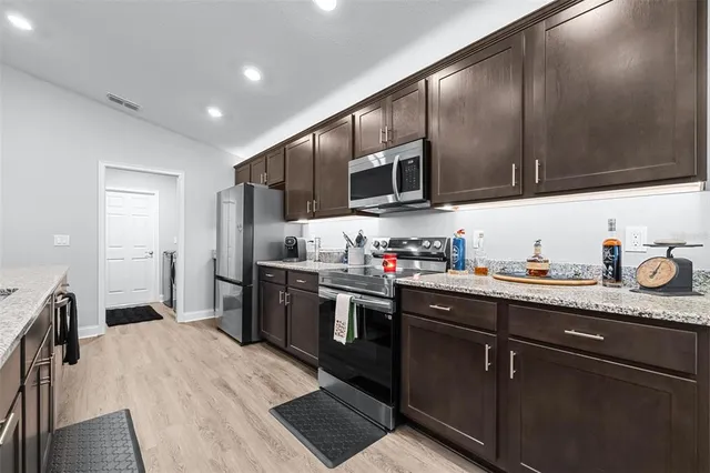 a kitchen with granite countertop lots of counter top space
