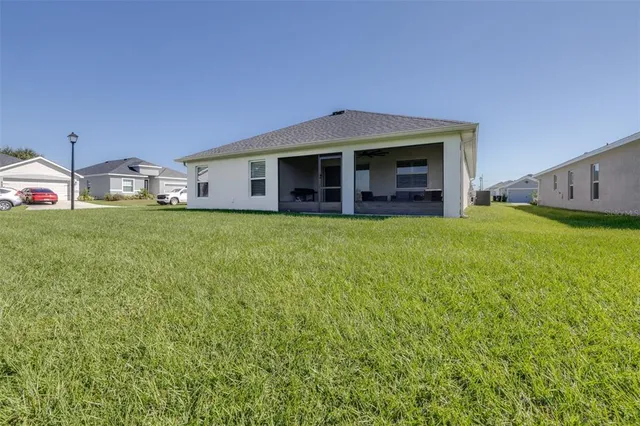 a aerial view of a house with a yard