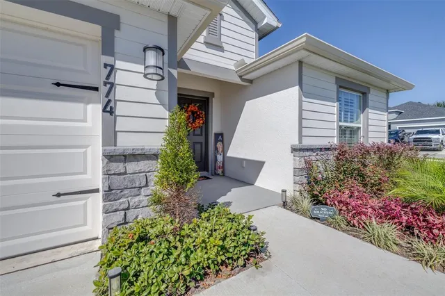 a front view of a house with a garage