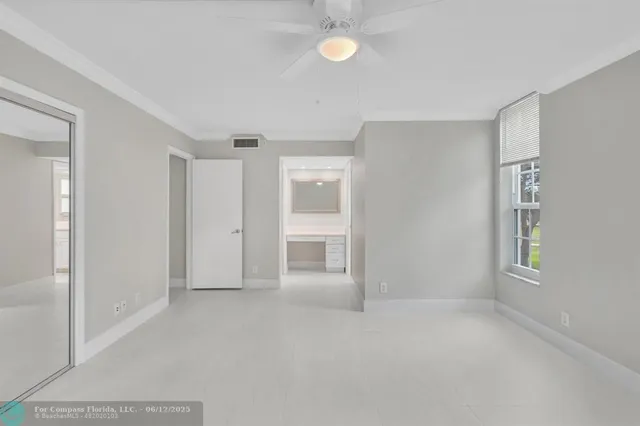 a view of an empty room with a window