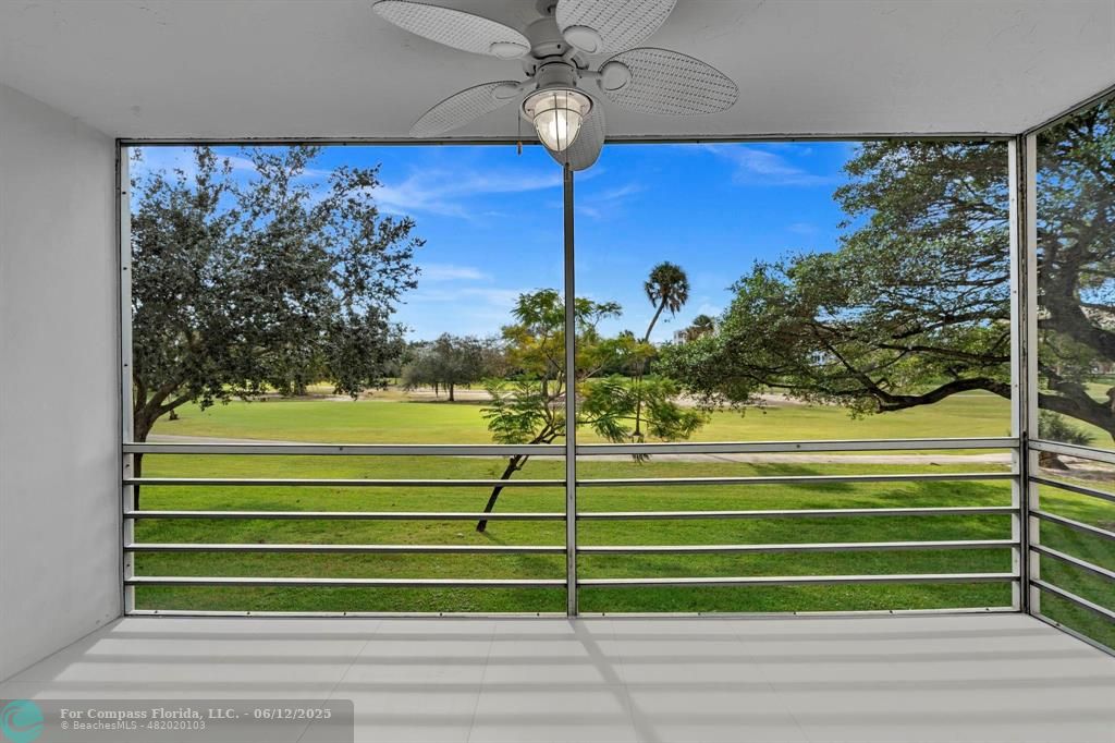 3800 Oaks Clubhouse Drive, Unit 201 Pompano Beach, FL 33069 - Photo 20 of 29 a view of a tennis court