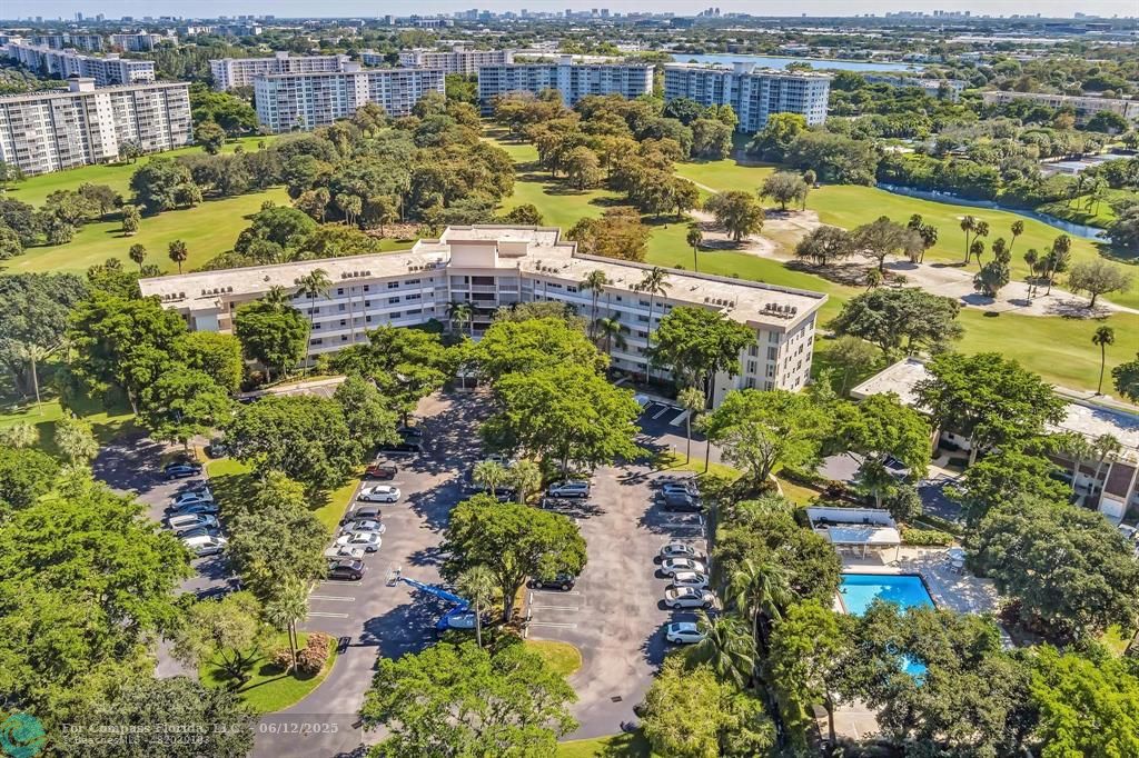 3800 Oaks Clubhouse Drive, Unit 201 Pompano Beach, FL 33069 - Photo 2 of 29 a view of a city