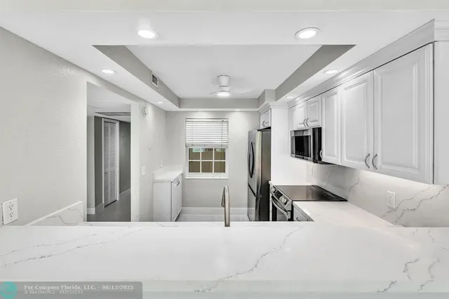 a bedroom with a bed closet and glass door