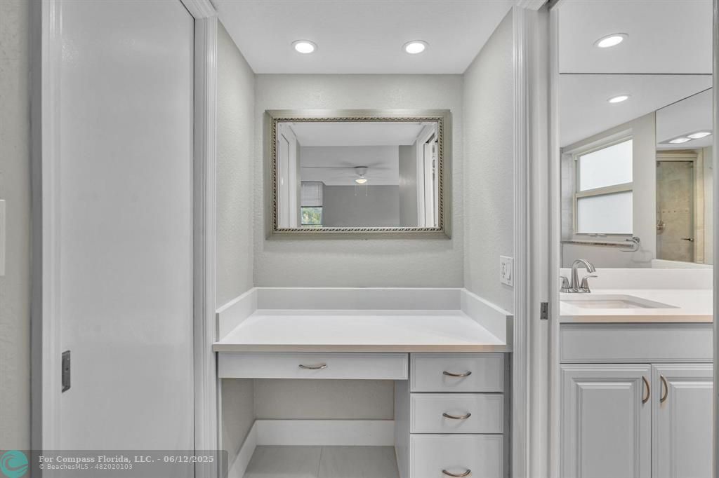 3800 Oaks Clubhouse Drive, Unit 201 Pompano Beach, FL 33069 - Photo 26 of 29 a bathroom with a sink and a bathtub