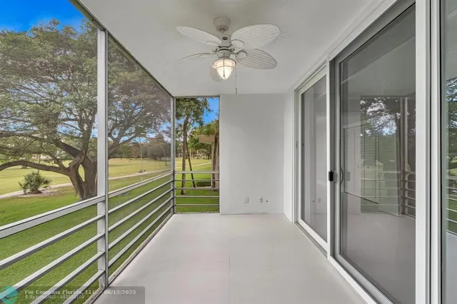 a view of a room with a large window