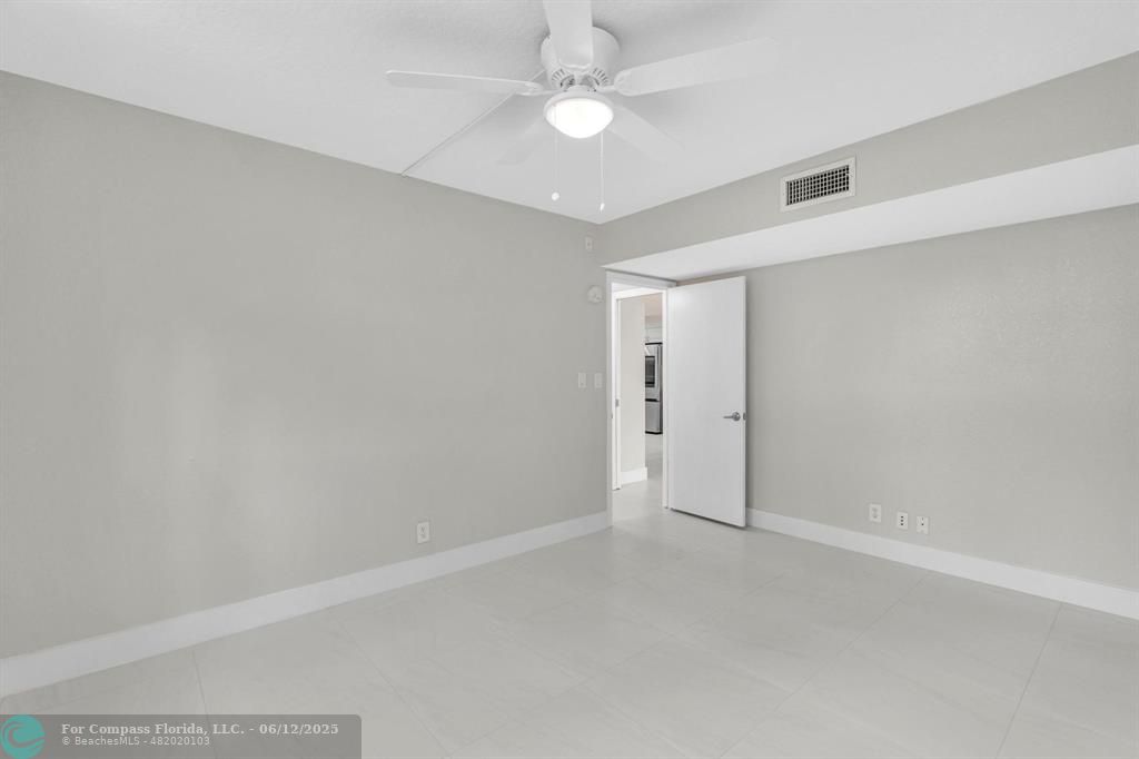 3800 Oaks Clubhouse Drive, Unit 201 Pompano Beach, FL 33069 - Photo 3 of 29 wooden floor in an empty room