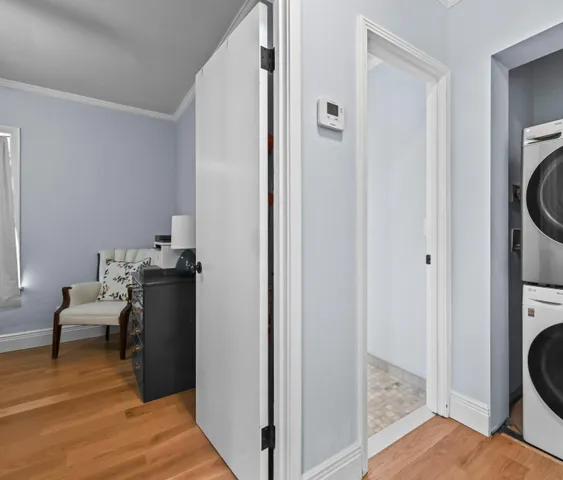 a view of a bedroom with washer and dryer