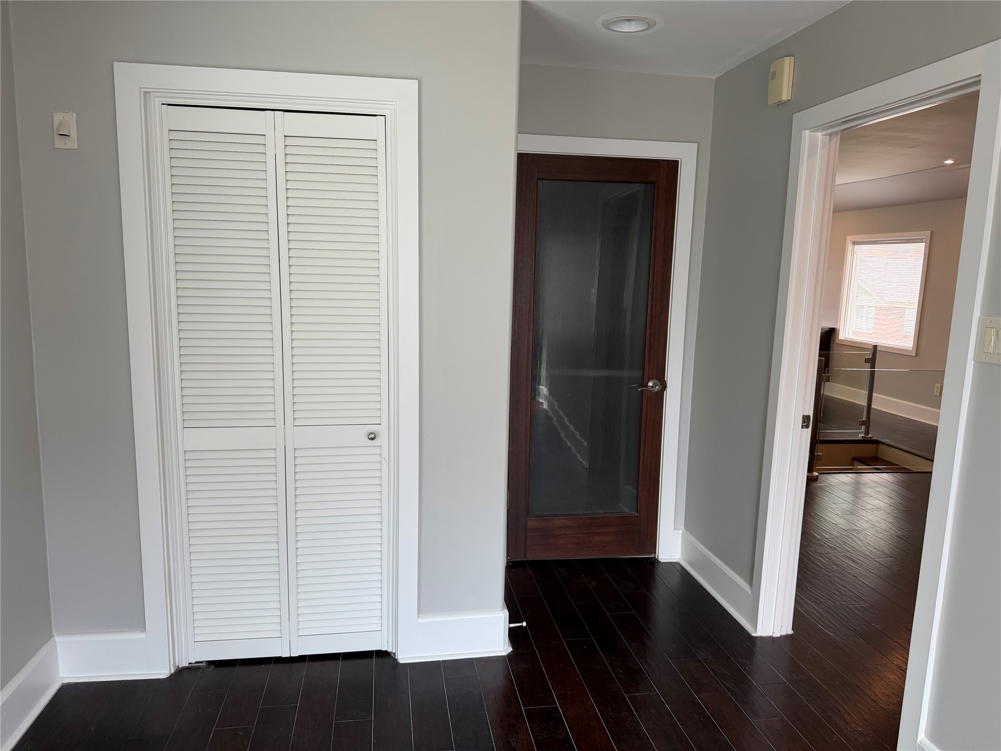 102 East 5th Street Houston, TX 77007 - Photo 26 of 44 Bedroom - Closet behind Left door, Bathroom behind Middle door, Dining Room through Right door