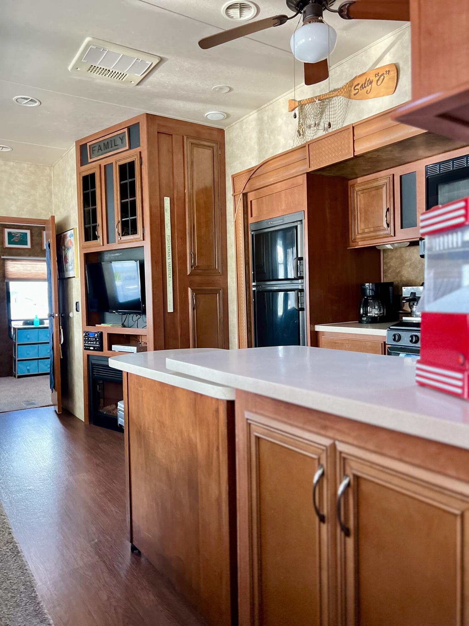 325 Calusa Street, Unit 245 Key Largo, FL 33037 - Photo 13 of 48 a kitchen with stainless steel appliances granite countertop a refrigerator and a stove