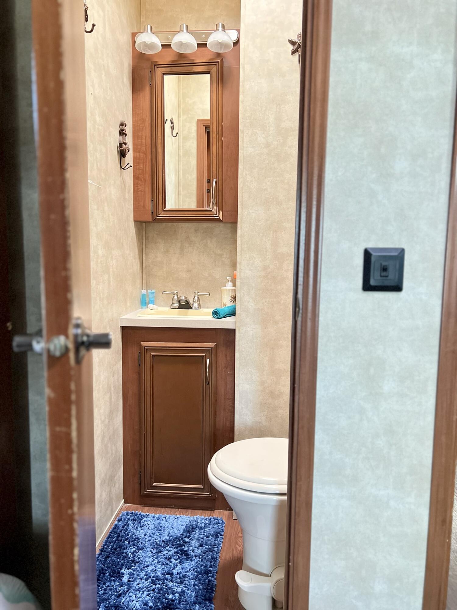 325 Calusa Street, Unit 245 Key Largo, FL 33037 - Photo 18 of 48 a bathroom with a toilet a sink and a shower