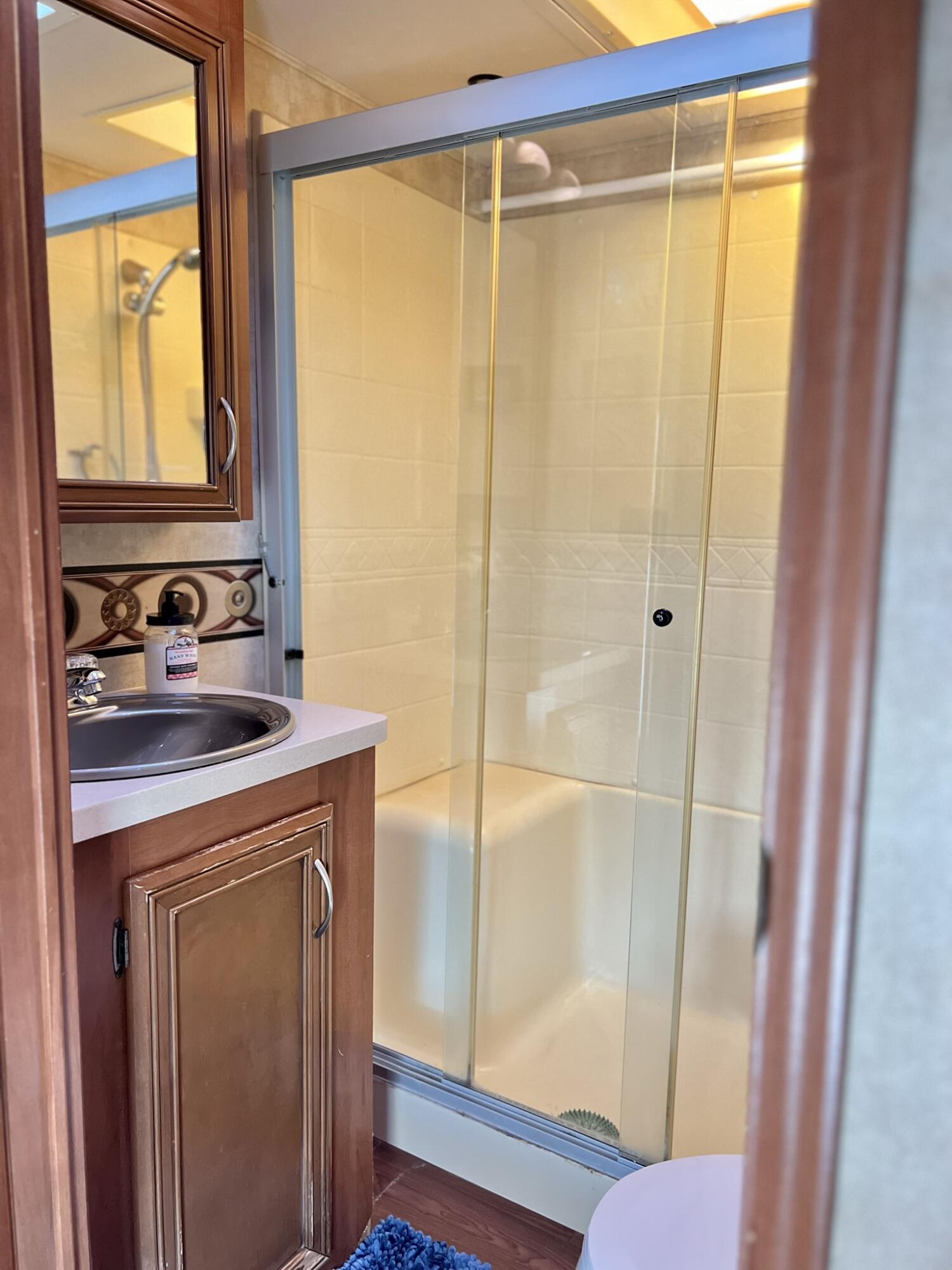 325 Calusa Street, Unit 245 Key Largo, FL 33037 - Photo 20 of 48 a bathroom with a shower and a sink