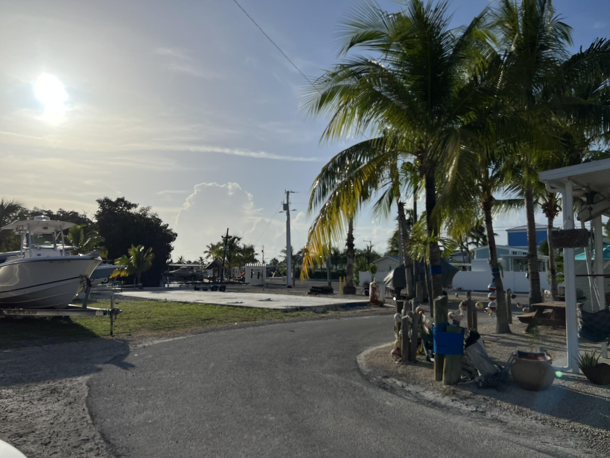 325 Calusa Street, Unit 245 Key Largo, FL 33037 - Photo 2 of 48 a view of a yard with palm trees
