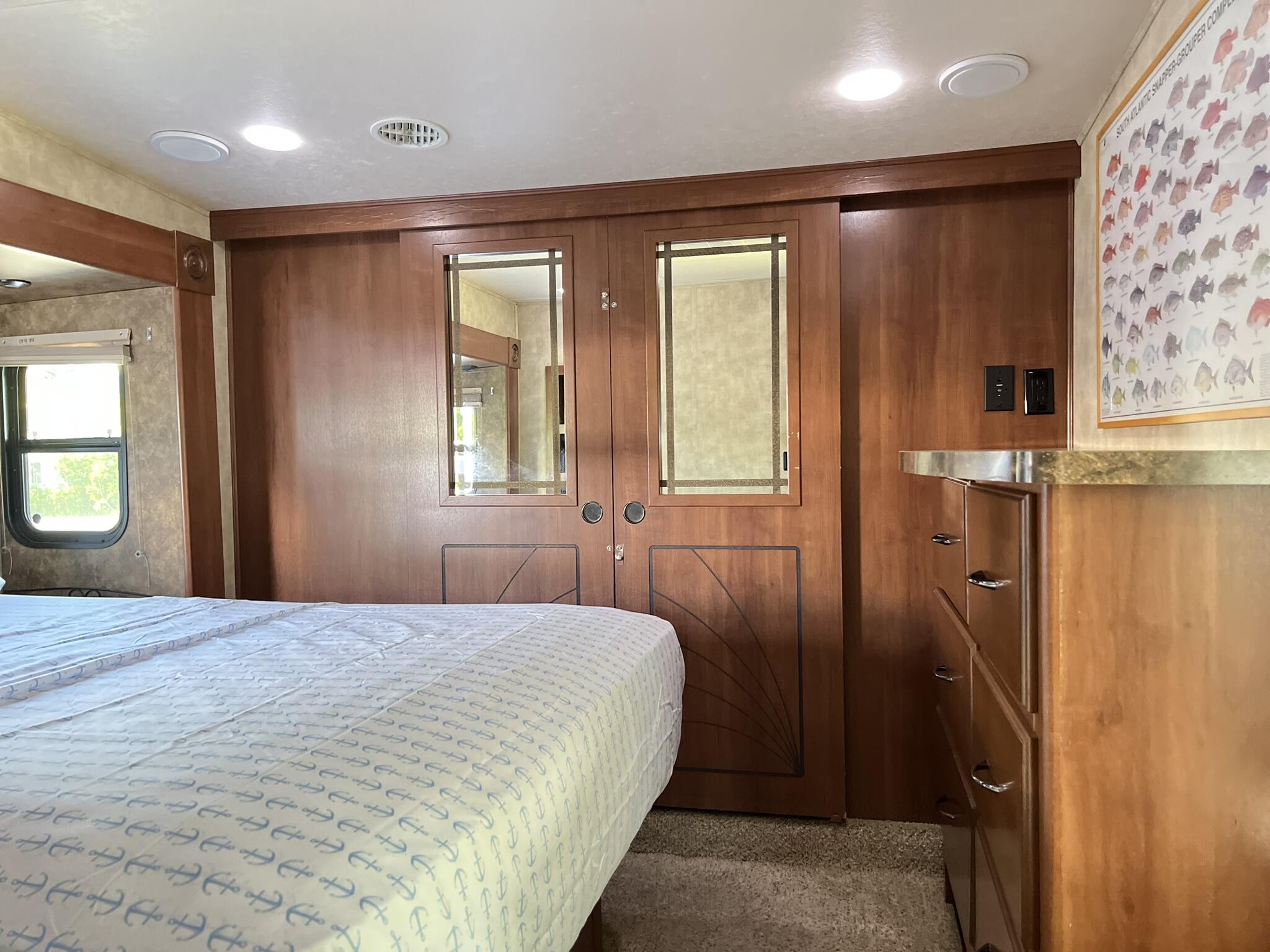 325 Calusa Street, Unit 245 Key Largo, FL 33037 - Photo 23 of 48 a bedroom with a large bed and a window