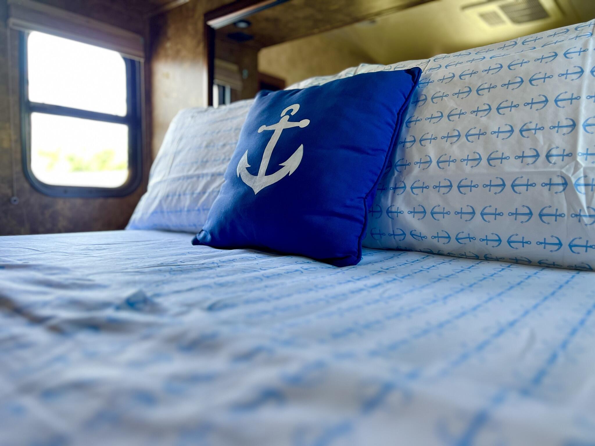 325 Calusa Street, Unit 245 Key Largo, FL 33037 - Photo 24 of 48 a bed sitting in a bedroom next to a window