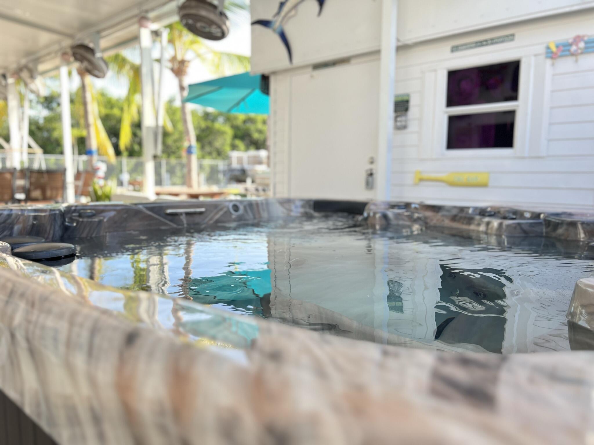 325 Calusa Street, Unit 245 Key Largo, FL 33037 - Photo 27 of 48 a bathroom with a granite countertop sink and a mirror