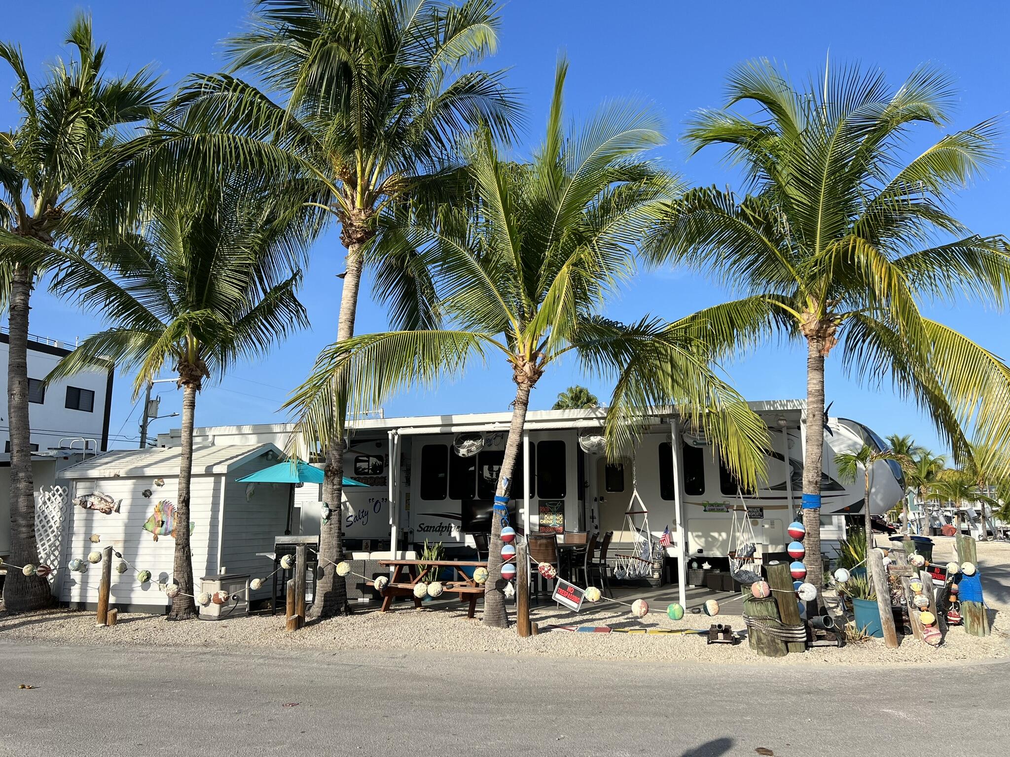 325 Calusa Street, Unit 245 Key Largo, FL 33037 - Photo 3 of 48 a view of street with sitting area