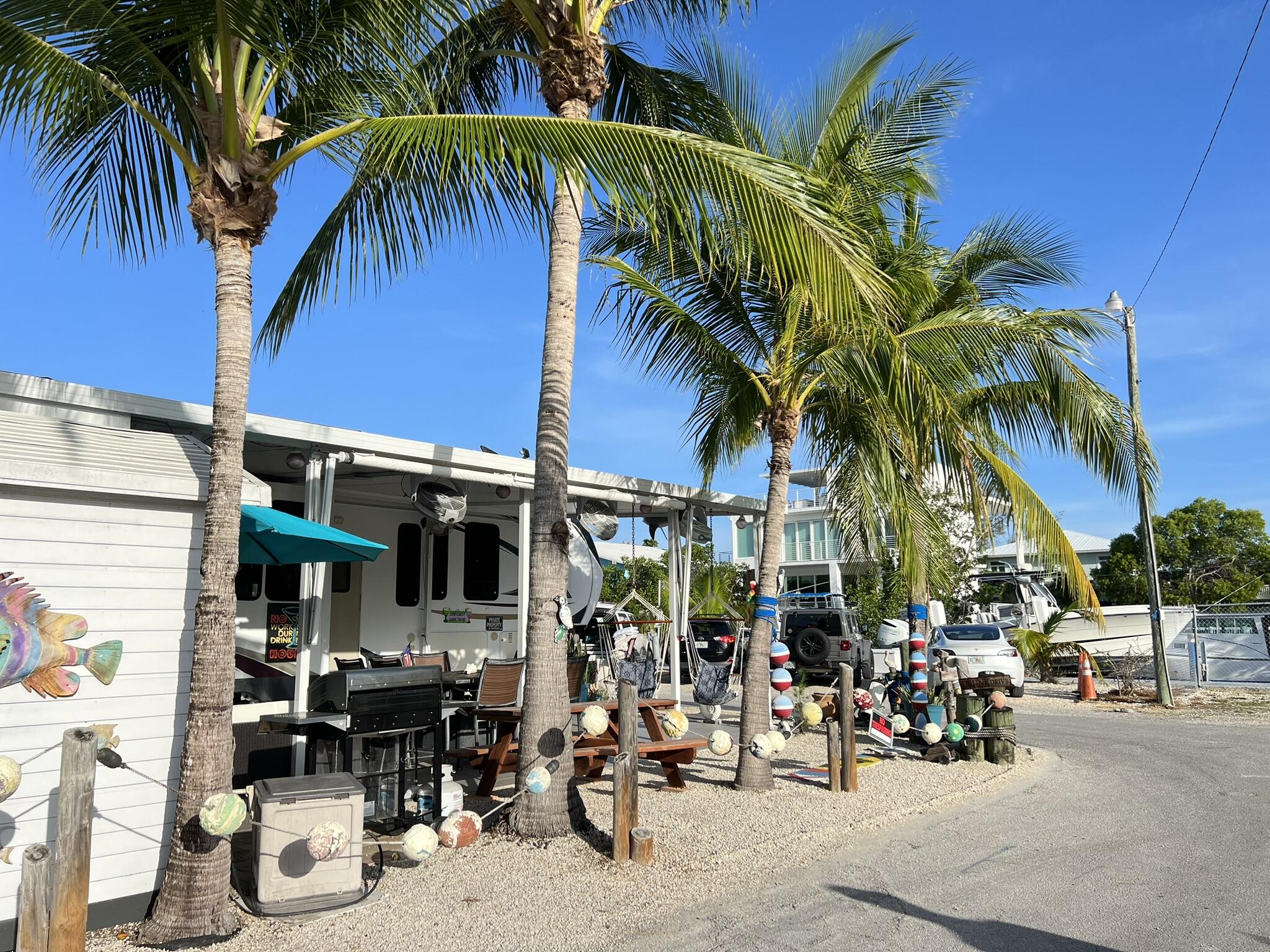 325 Calusa Street, Unit 245 Key Largo, FL 33037 - Photo 4 of 48 a view of street with sitting area