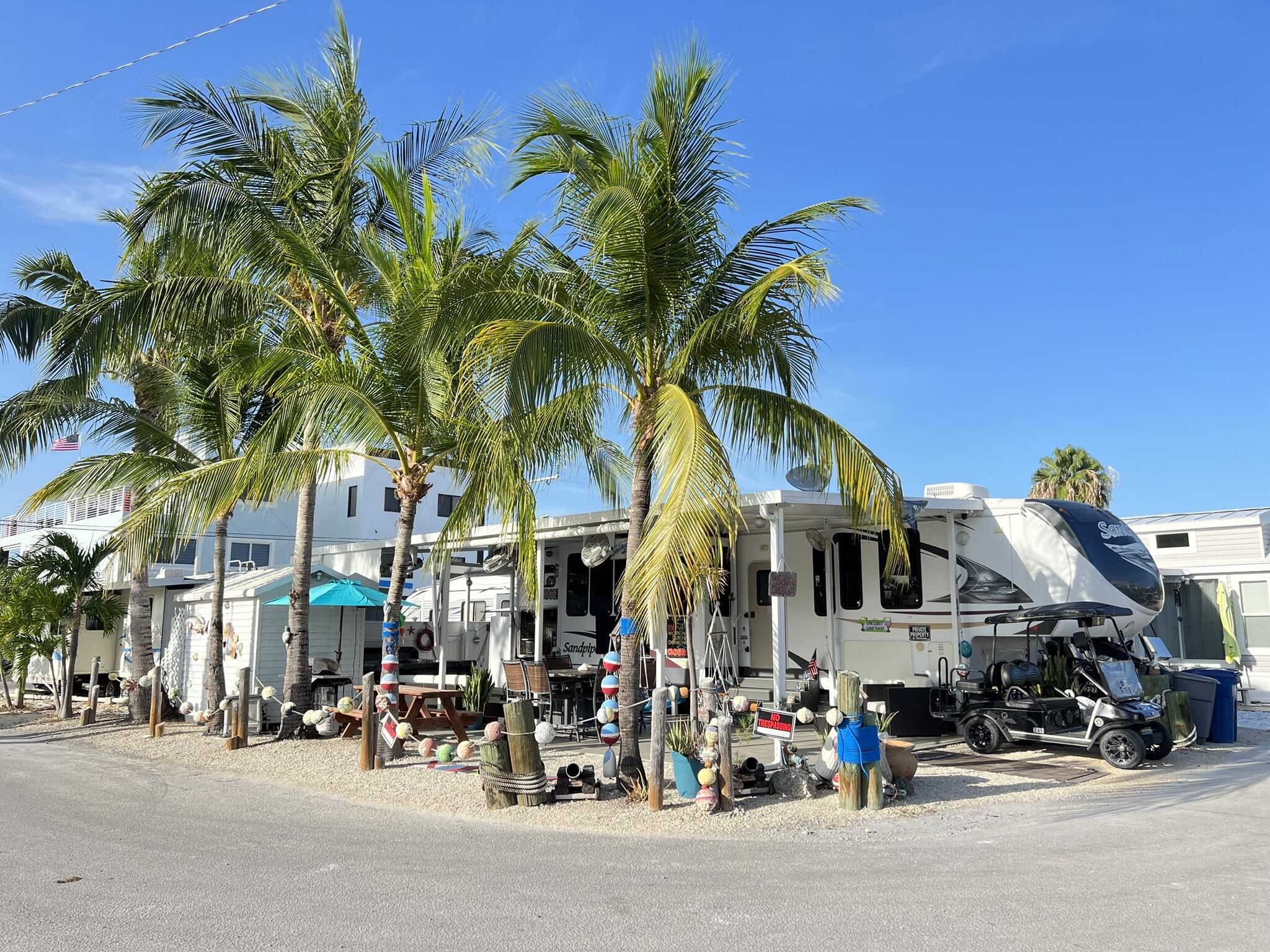 325 Calusa Street, Unit 245 Key Largo, FL 33037 - Photo 5 of 48 a view of street with small cars