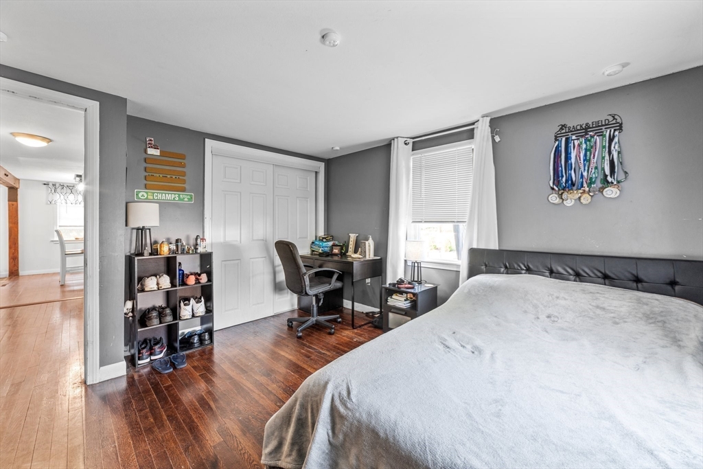 22 Eames Avenue Amherst, MA 01002 - Photo 13 of 36 a bed room with a bed and a chair