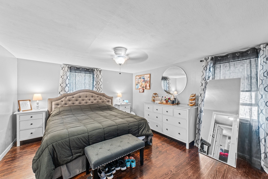 22 Eames Avenue Amherst, MA 01002 - Photo 15 of 36 a bedroom with furniture and a wooden floor