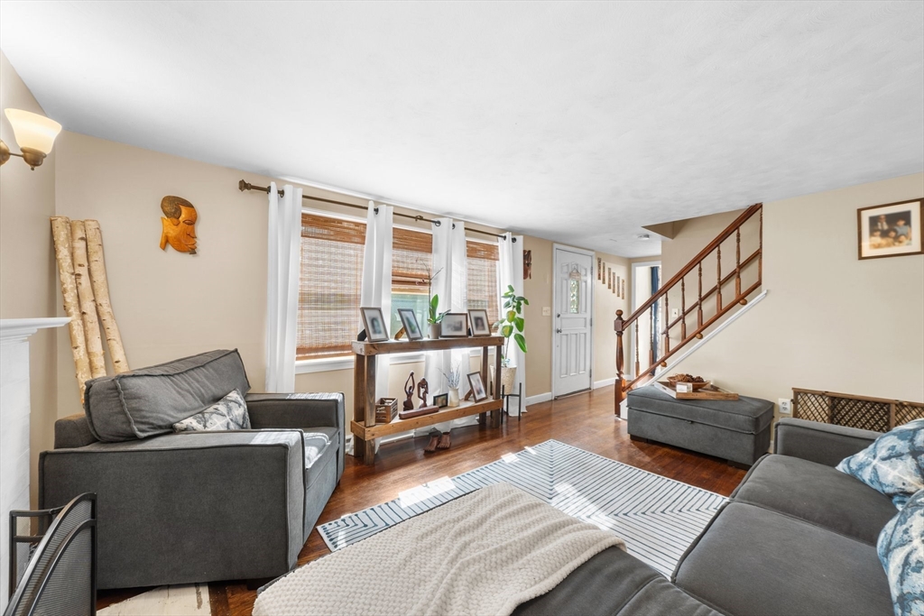 22 Eames Avenue Amherst, MA 01002 - Photo 2 of 36 a living room with furniture and a wooden floor