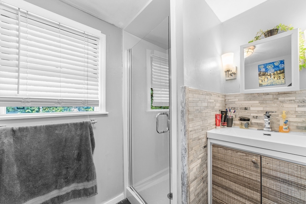 22 Eames Avenue Amherst, MA 01002 - Photo 23 of 36 a bathroom with a sink and a mirror