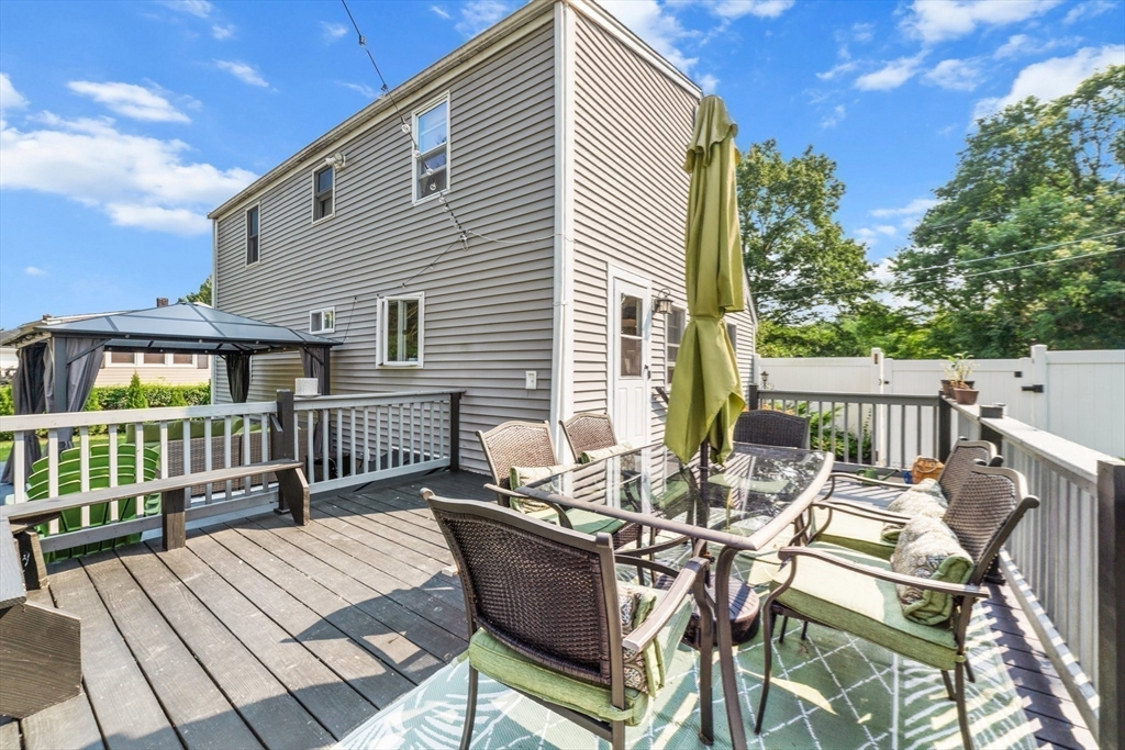 22 Eames Avenue Amherst, MA 01002 - Photo 29 of 36 a view of a patio with couches chairs and wooden floor