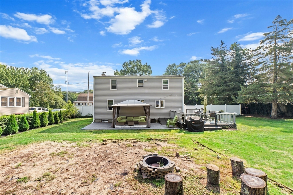 22 Eames Avenue Amherst, MA 01002 - Photo 32 of 36 a view of a house with backyard sitting area and garden