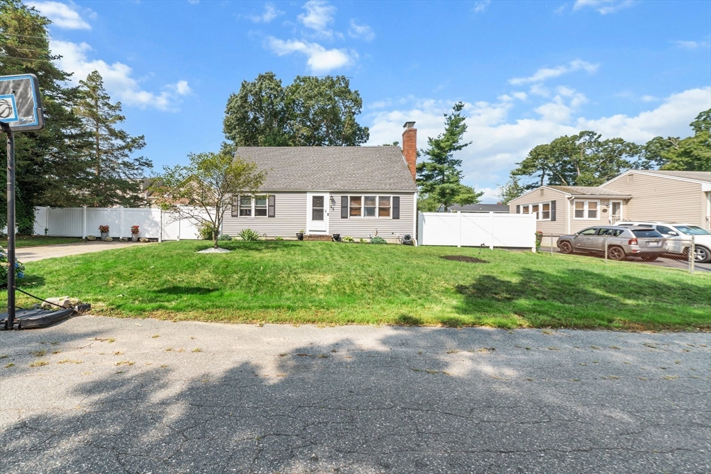 22 Eames Avenue Amherst, MA 01002 - Photo 34 of 36 a view of house in front of a big yard with plants and large trees