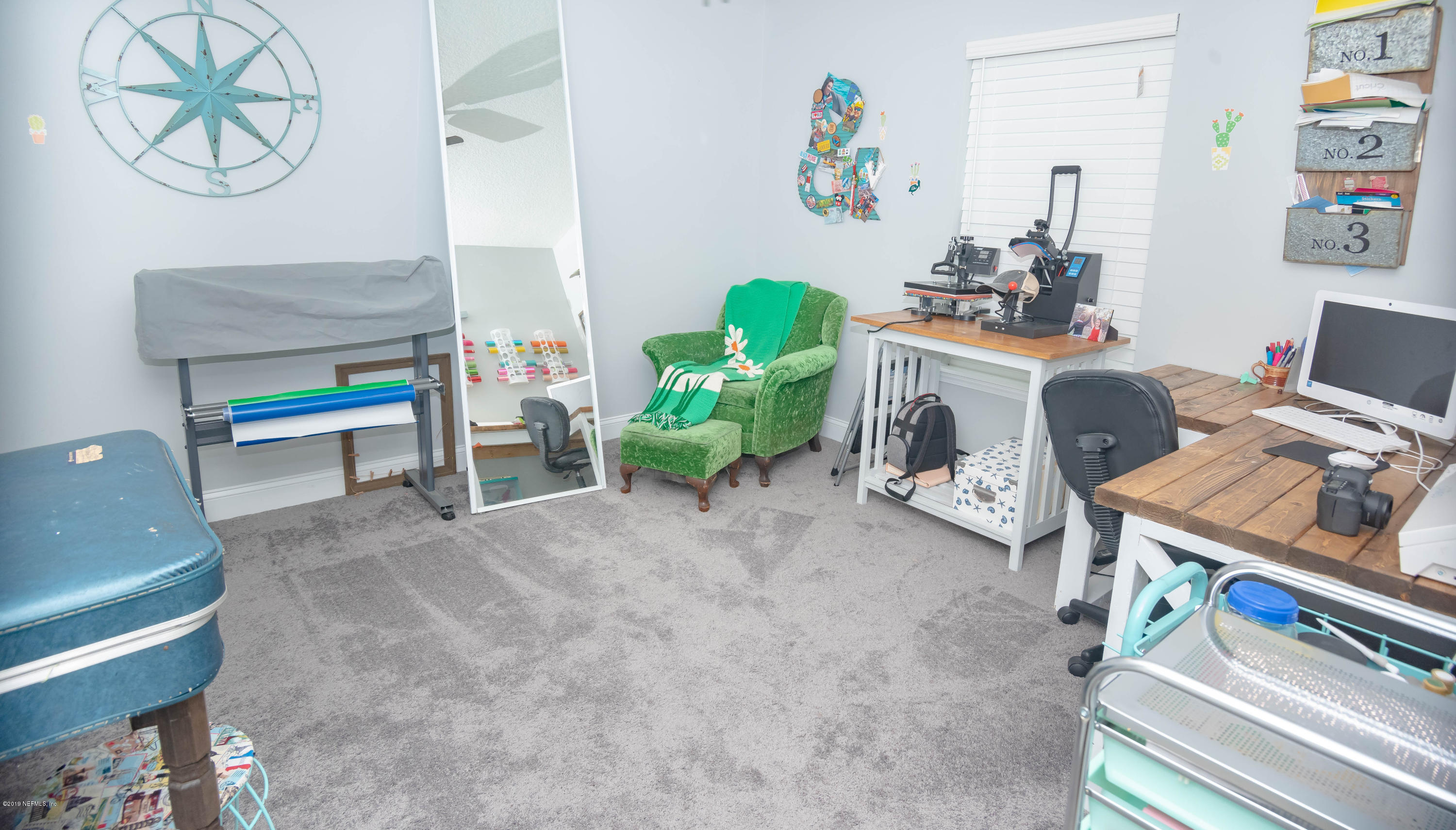 9964 River Oak Circle Glen St. Mary, FL 32040 - Photo 14 of 41 a living room with furniture and a workspace