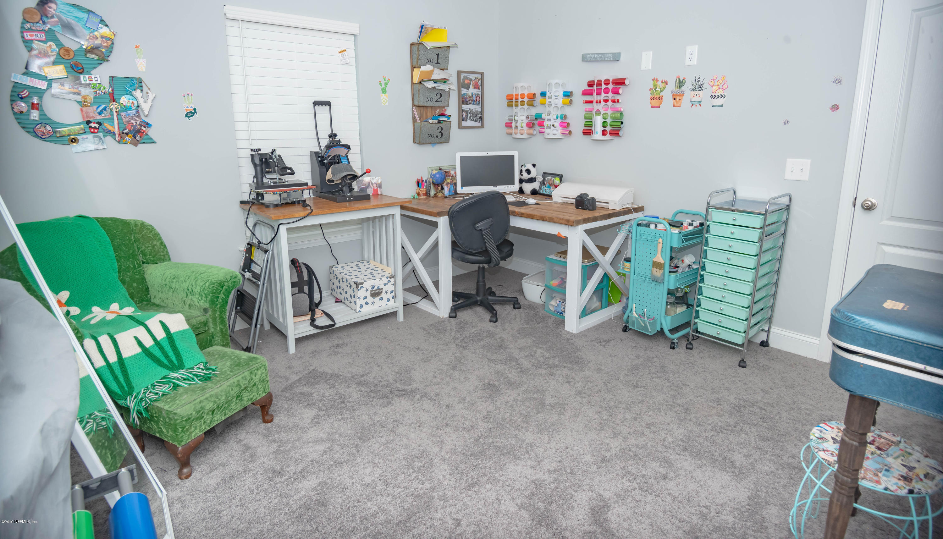 9964 River Oak Circle Glen St. Mary, FL 32040 - Photo 15 of 41 a room with furniture a rug and a large window
