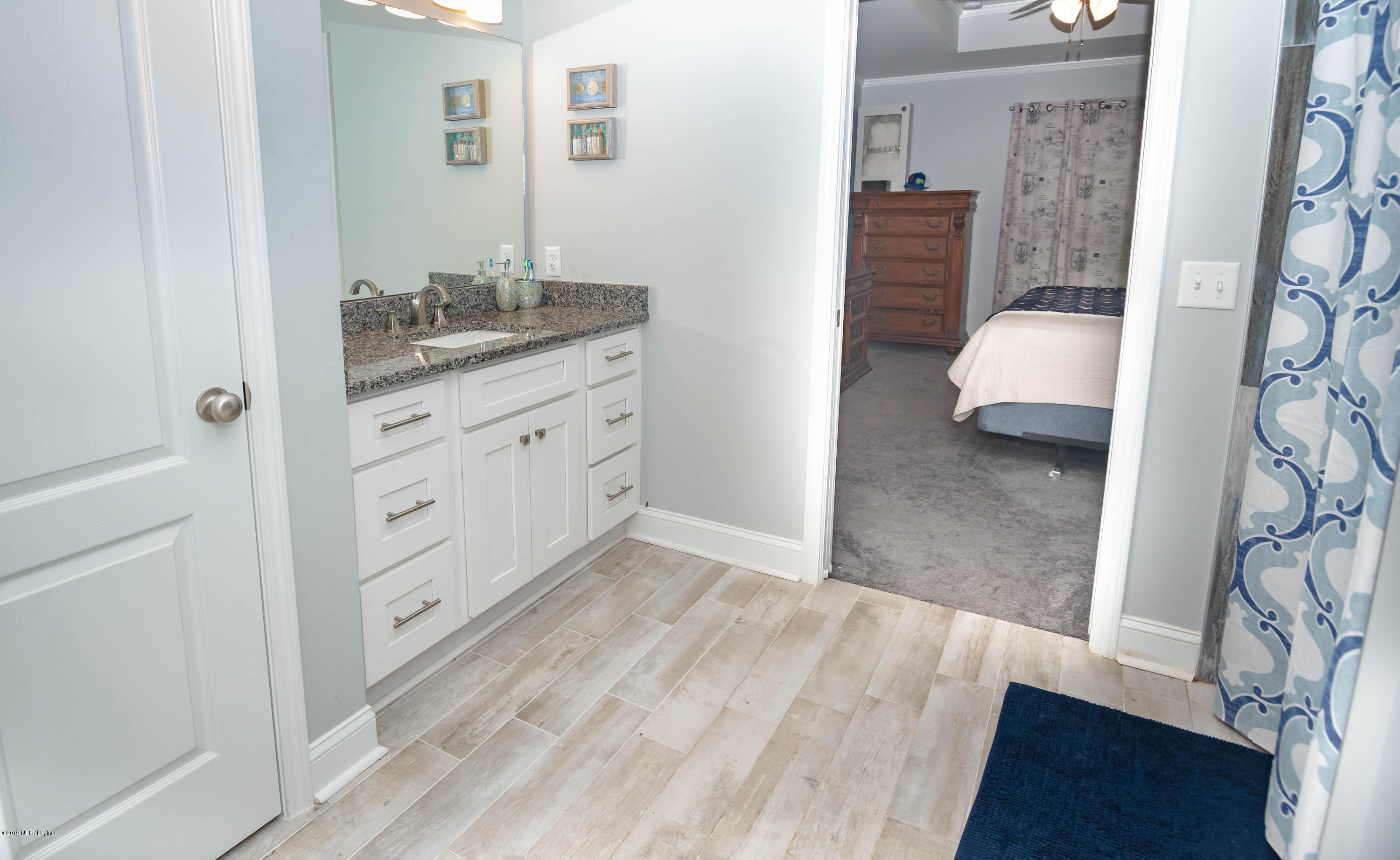 9964 River Oak Circle Glen St. Mary, FL 32040 - Photo 19 of 41 a bedroom with a bed and a dresser