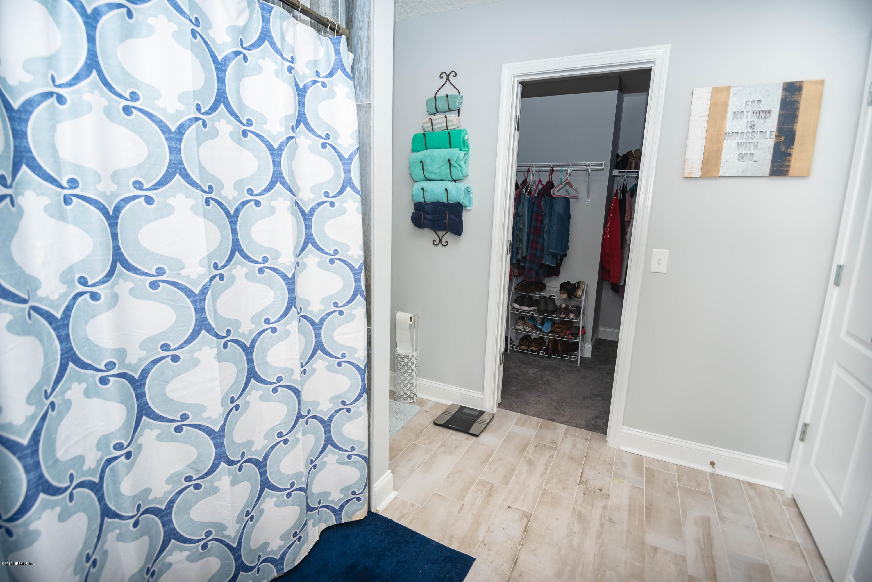 9964 River Oak Circle Glen St. Mary, FL 32040 - Photo 20 of 41 a bathroom with a sink and a mirror